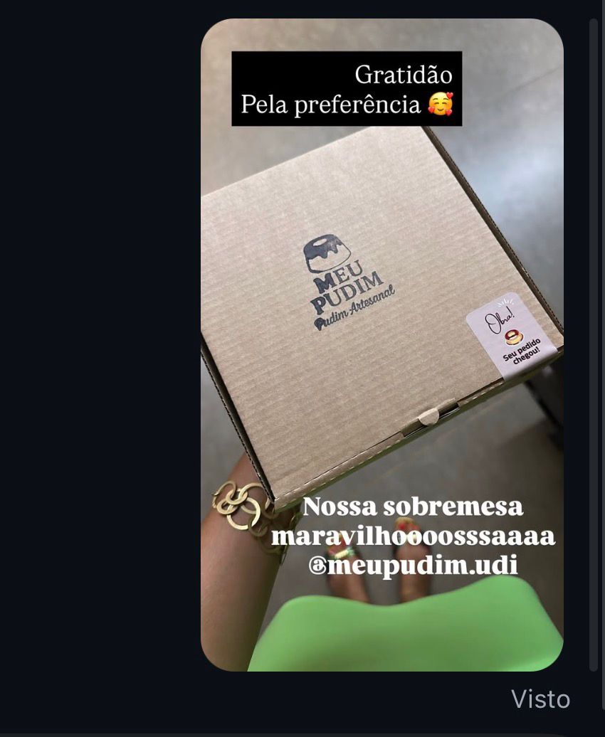 Story compartilhado: foto da caixa de entrega com texto 'Nossa sobremesa maravilhoooossssaaaa @meupudim.udi'